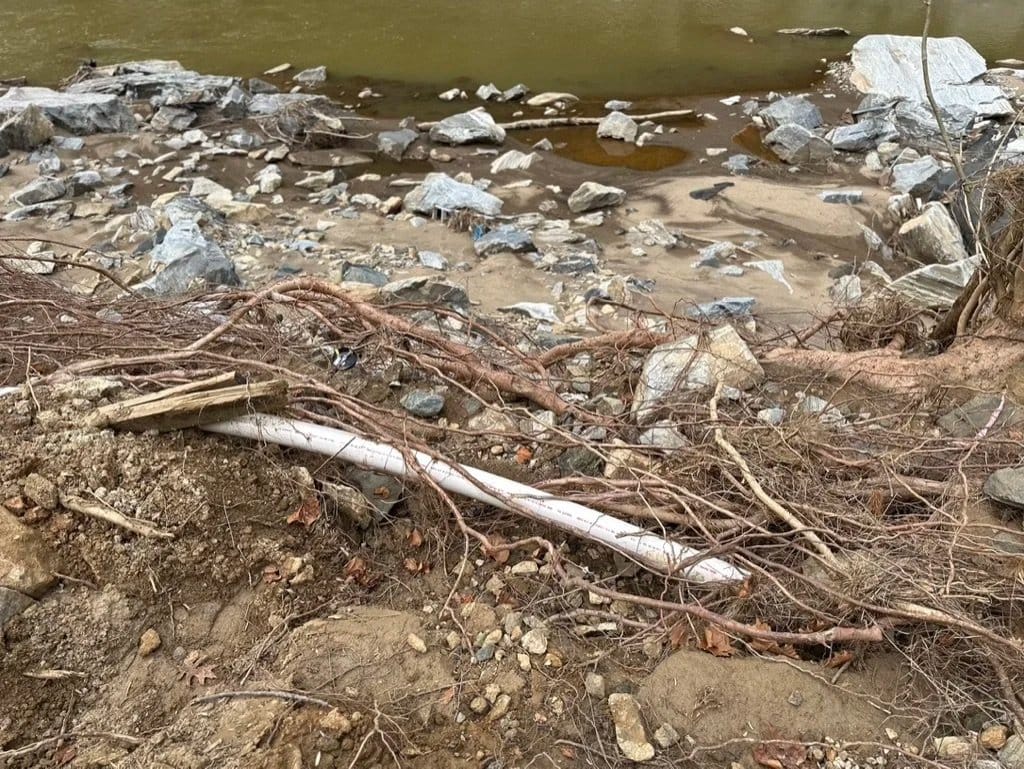 Rock, roots and debris left along a creek bank after heavy rain.